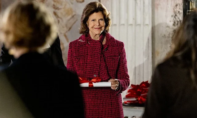 Queen Silvia of Sweden wore a red wool jacket and skirt