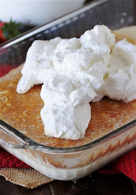 Frosting Tres Leches Cake with Whipped Cream Image
