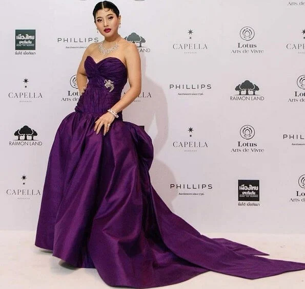 Princess Sirivannavari wore a dark purple Thai silk evening gown designed by herself and which is from her own brand Sirivannavari Bangkok couture