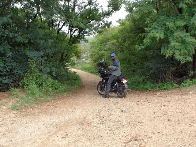 Chinmay riding the muddy trails into the Ganalu falls