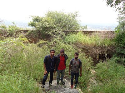 The krew taking a photo amidst the shrubs and greenery on our way down