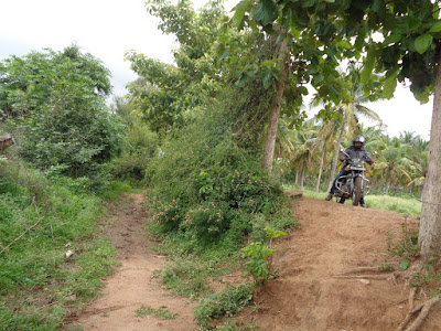 Ashok navigating into the fields to avoid the angry mob infested roads
