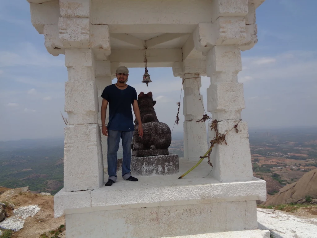 Savandurga Summit Selfie: A smiling close-up photo of the trekkers at the highest point.