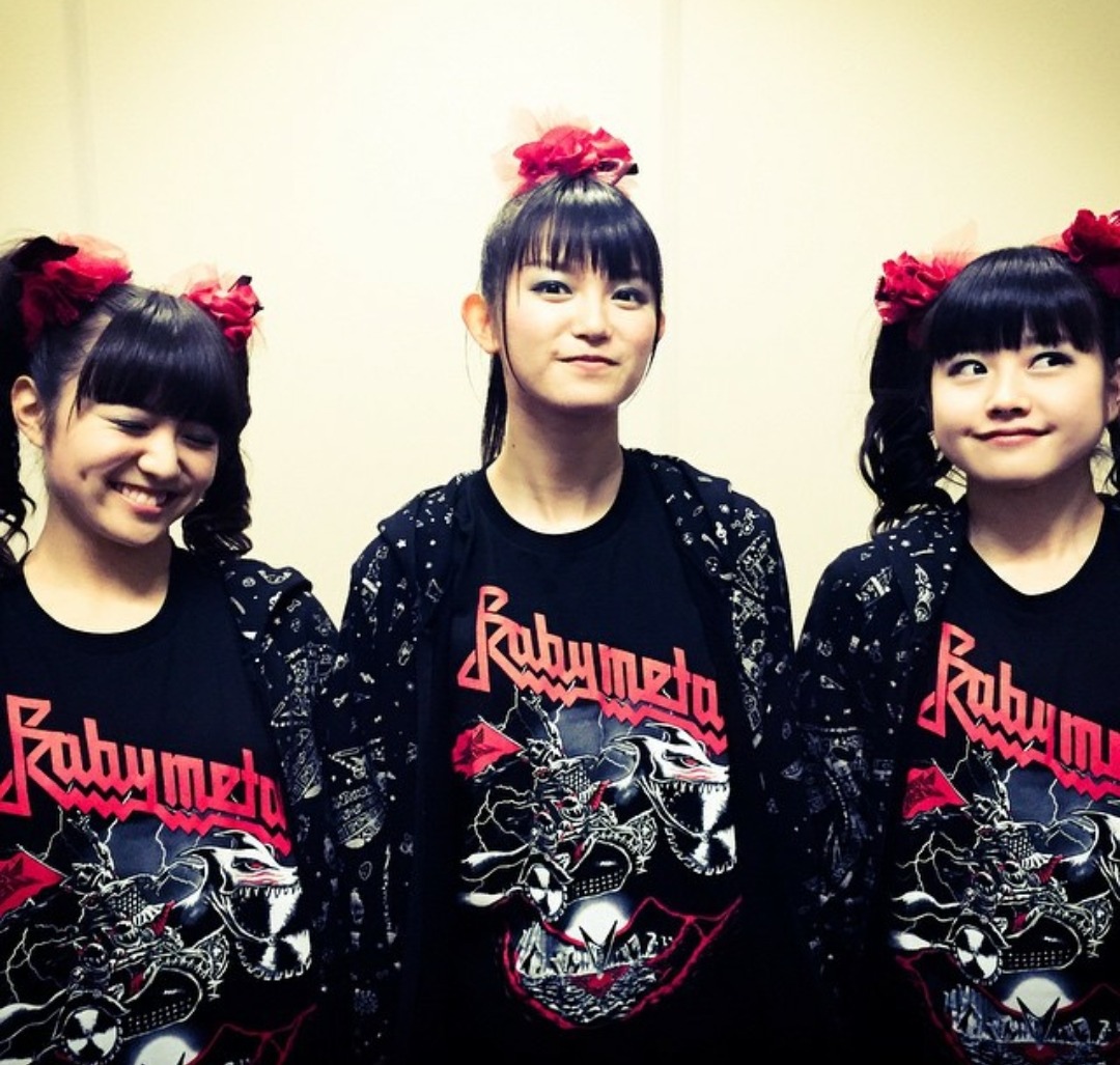 BABYMETAL wearing T-shirts and jackets offstage