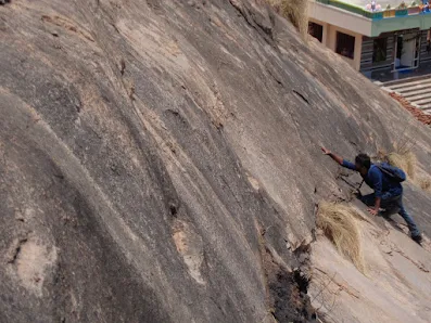 the hiker attempts the steepest rock face at bhasmangi fort trek