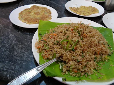 A nice fried rice and eggs lunch after a hard grind on the road