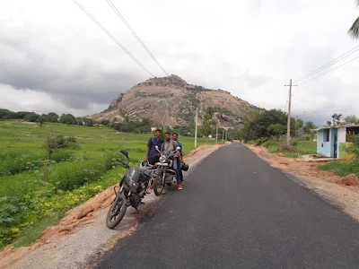The krew on a small pitstop, with channarayanadurga in the background