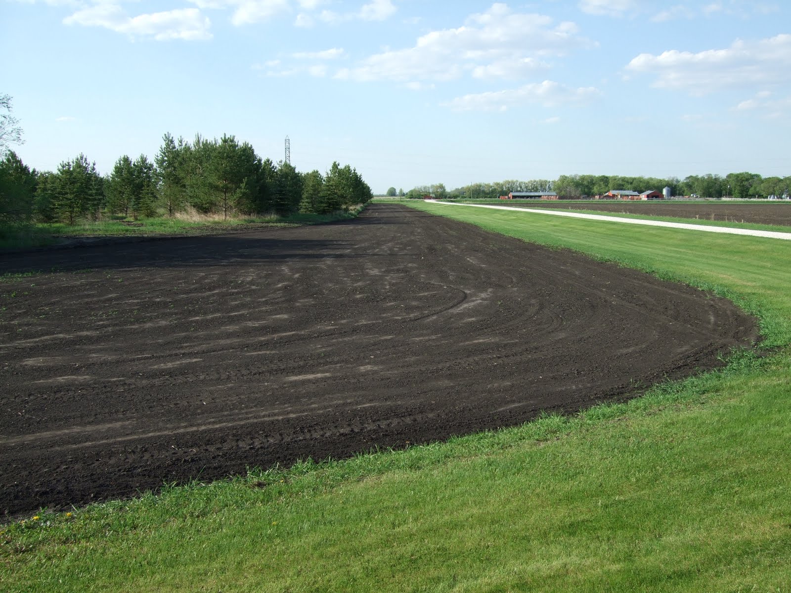 Little House on the Portage la Prairie Runway Dirt Moving & Grass Seed