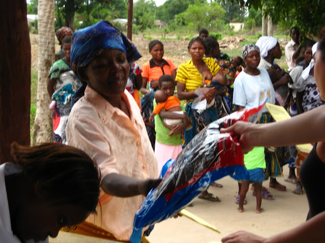 woman receiving her mosquito net