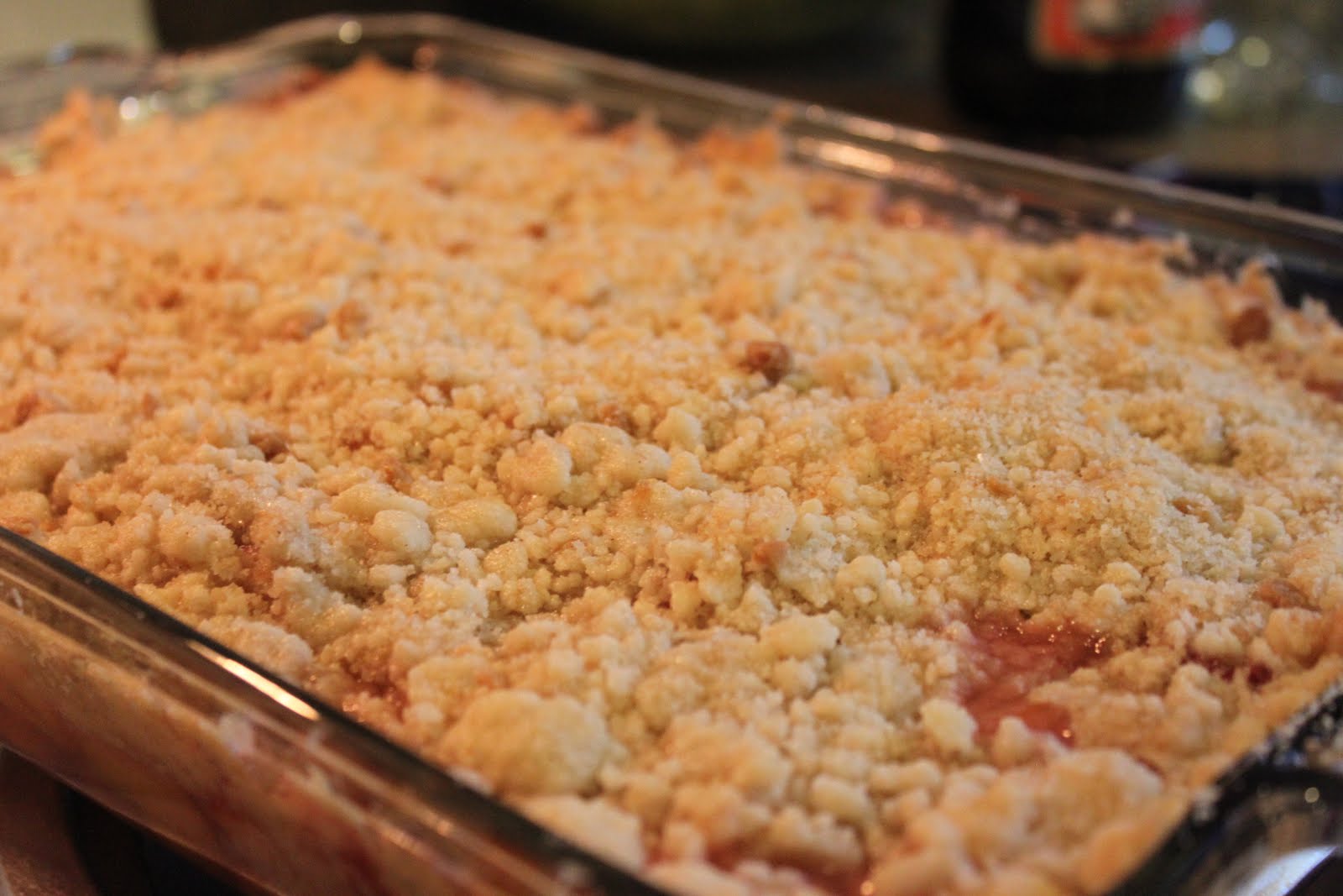 the pax and ash a cakery Peach Cobbler with delicious crumble topping