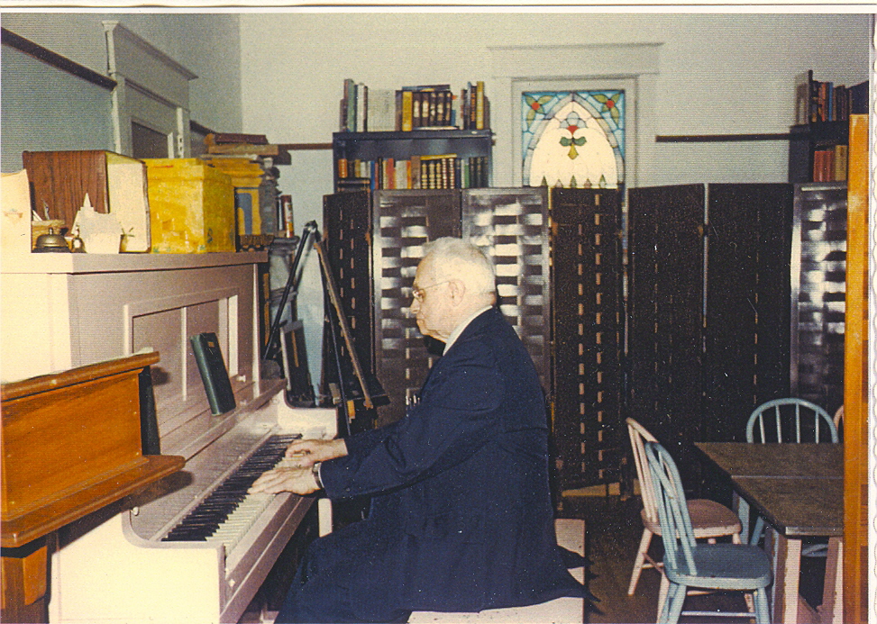 [Pastor+Drexler+playing+piano+in+Sunday+School+room+year+unknown.jpg]