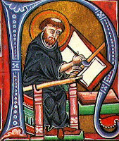 Medieval monk writing on a book tablet