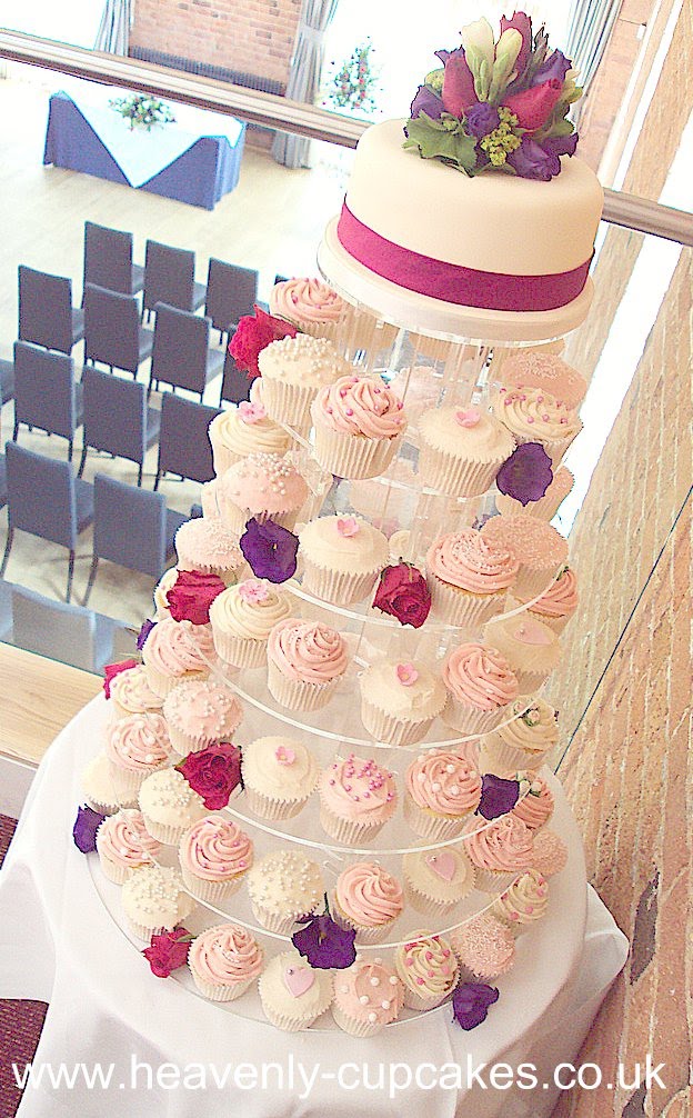 The pink and white wedding cupcakes were all decorated with assorted 