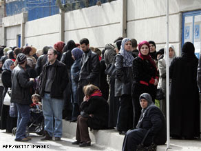 Iraqi refugees wait to register outside a U.N. office in Duma, Syria, on Feb. 14th.