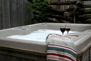 hot tub with wine glasses on the side