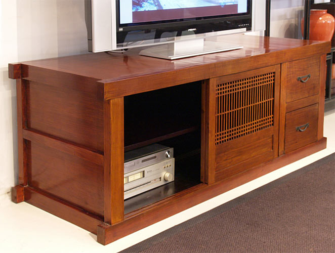 a wooden TV stand is still