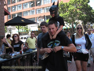 Young Bat Man rides on his dad's shoulders - Photo by San Diego video producer Patty Mooney of Crystal Pyramid Productions