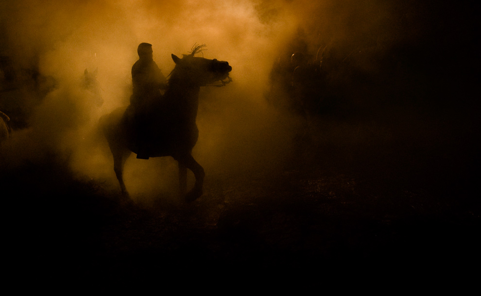 [A+man+rides+a+horse+near+a+bonfire+-+Daniel+Ochoa+de+Olza.jpg]