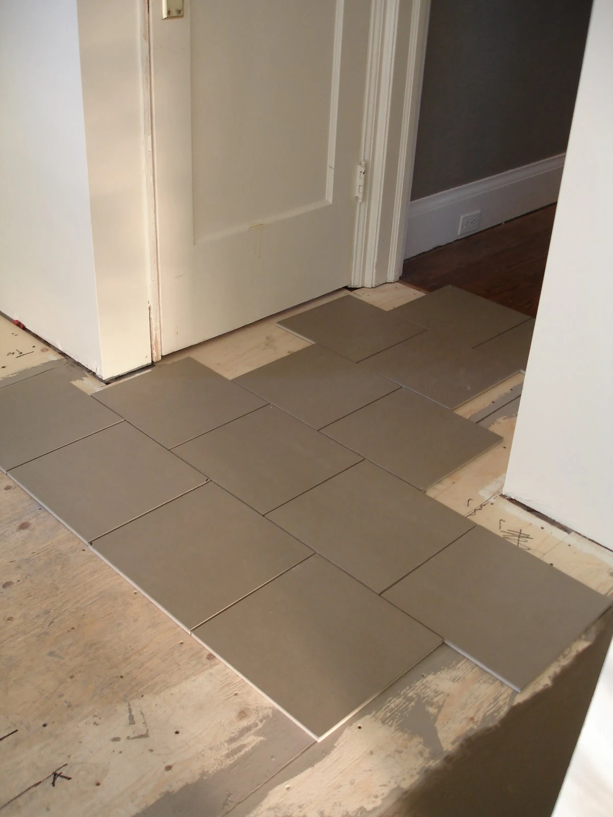 laying tile, diy tile floor