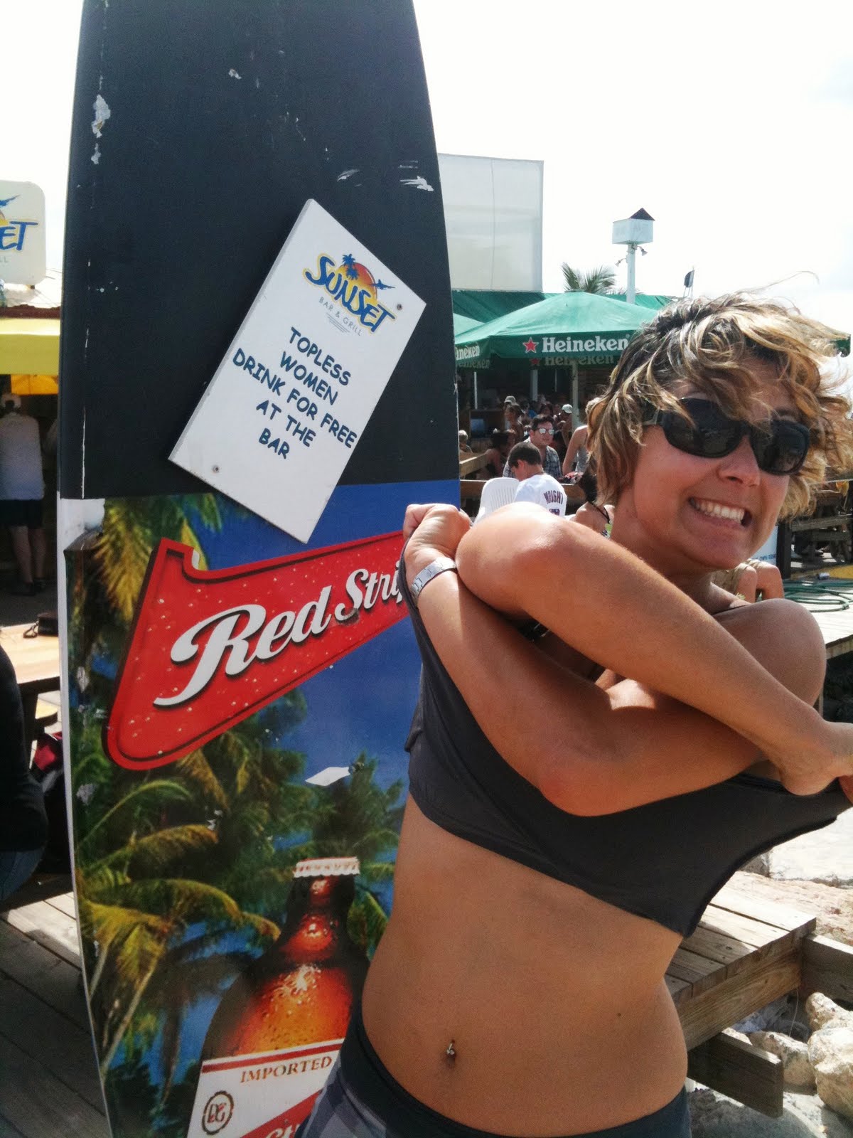 The Sunset Bar at Airport beach claims that topless women drink for free. 