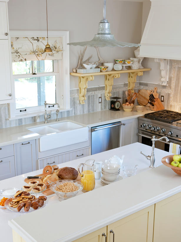 Sarah Richardson's farmhouse chic kitchen with galvanized pendant, yellow accents, and corbel shelves.