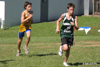 Cade Zimmerman of Deerlake trying to shake off a pursuer from Raa early in the boys' two-mile at the Owl Run.
