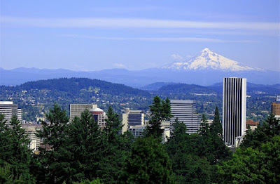 Photo of the Portland skyline, trees, and Mt. Hood