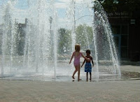 Photo of kids playing in a fountain