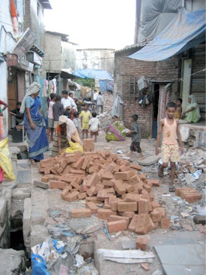 Photo of people working with bricks in Dharavi