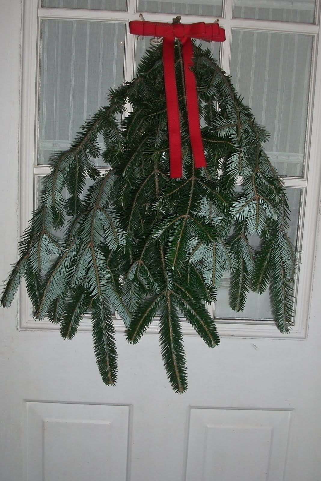 making a pine door swag with christmas tree clippings. Monkeybean