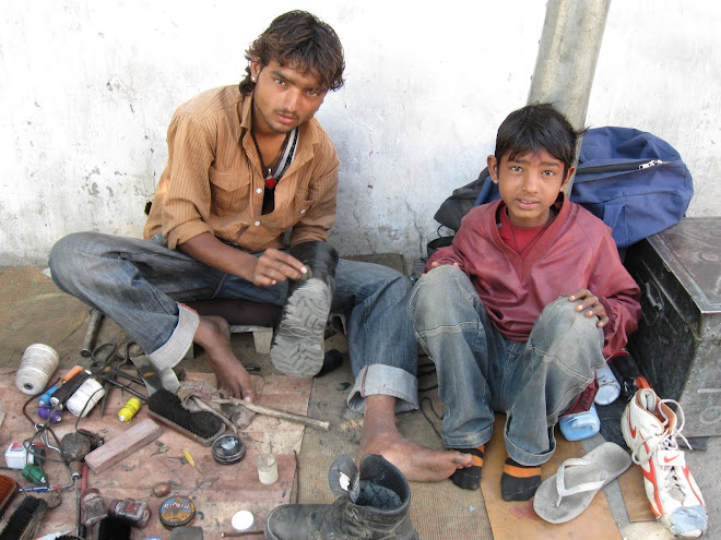 Shoe Shiners Polishing my boots in Leh.