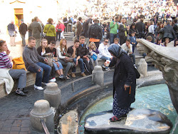 Roma lady getting a drink