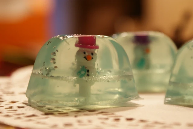plastic snowman pink hat glitter soap snow globe