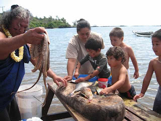 Uncle Leimana and keikis with fish from fispond