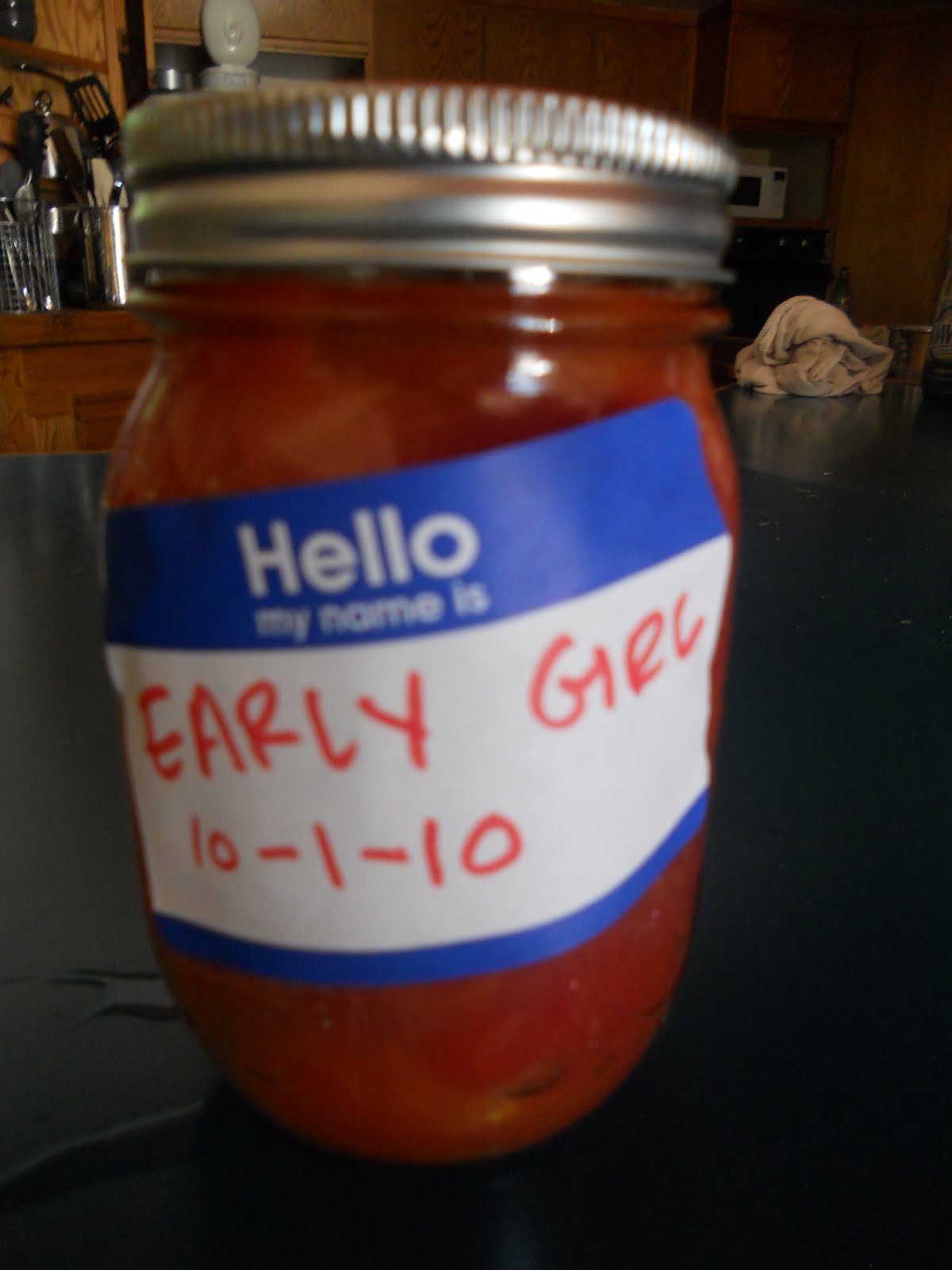 CSA girl Canning Early Girl Tomatoes