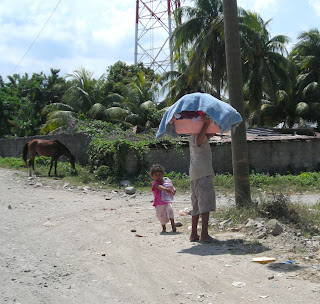 boy carrying laundry, Honduras