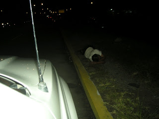 drunk man sleeping it off by the road