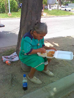 Honduran woman eating lunch, La Ceiba, Honduras