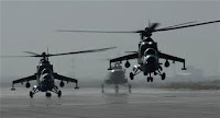 Two MI-35 attack helicopters from the Afghan Army Air Corps launch on a gunnery training mission at Kabul International Airport May 27. This mission was the first time rockets have been flown by the Afghan Air Corps in more than 10 years and will eventually allow the Afghans to provide their own close-air support...