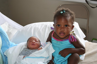 Infant baby boy with his full sister before being placed for adoption