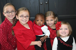 McKnight family kid photo - 6 siblings smiling and posing for a picture together