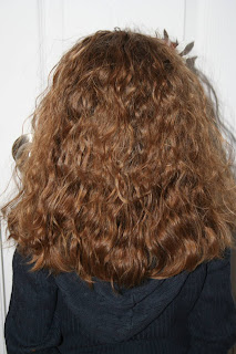Back view of young girl modeling 2nd Day Curls from Double-French Braids
