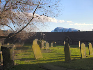 All Saints Church graveyard. Sage gateshead pokes it's head above the wall