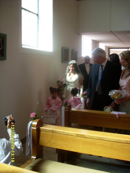 going ifrot of the church with my two flower girls my prince behind
