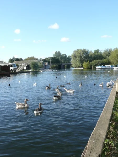 On the left, deep shades of blue in the River Bure at Wroxham, on the right the ghostly looking Little Hautbois Hall