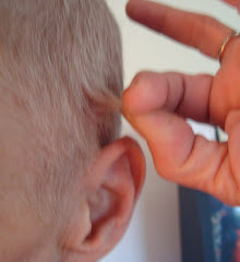 ALMOST touching the top of the ear!!