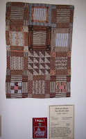 sampler quilt in browns