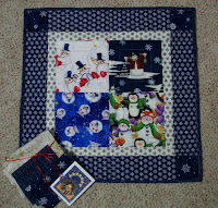 Little quilt with four squares of snowmen fabric
