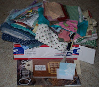 lots of fabric scraps piled on top of the Priority Box that they were stuffed into
