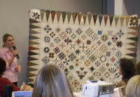 Edyta Sitar with her version of the Dear Jane quilt